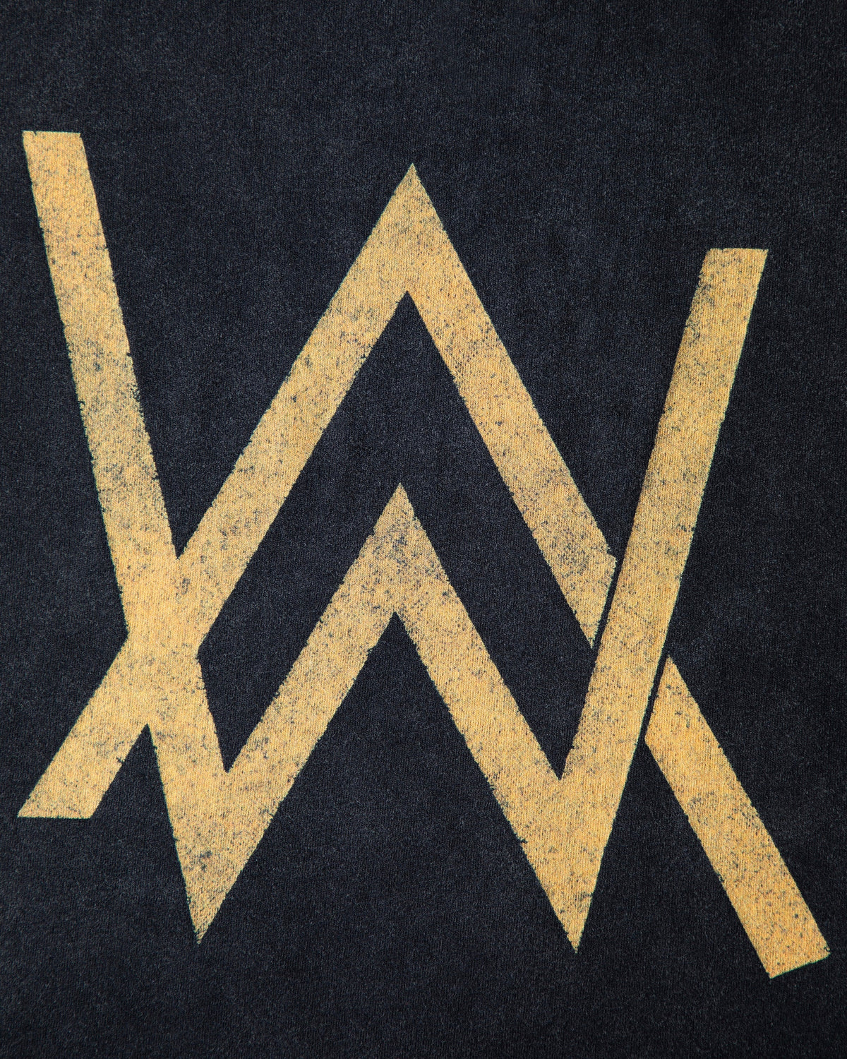 Alan Walker Rise Of The Drone Vintage T-Shirt back logo close-up, distressed gold AW emblem on faded black