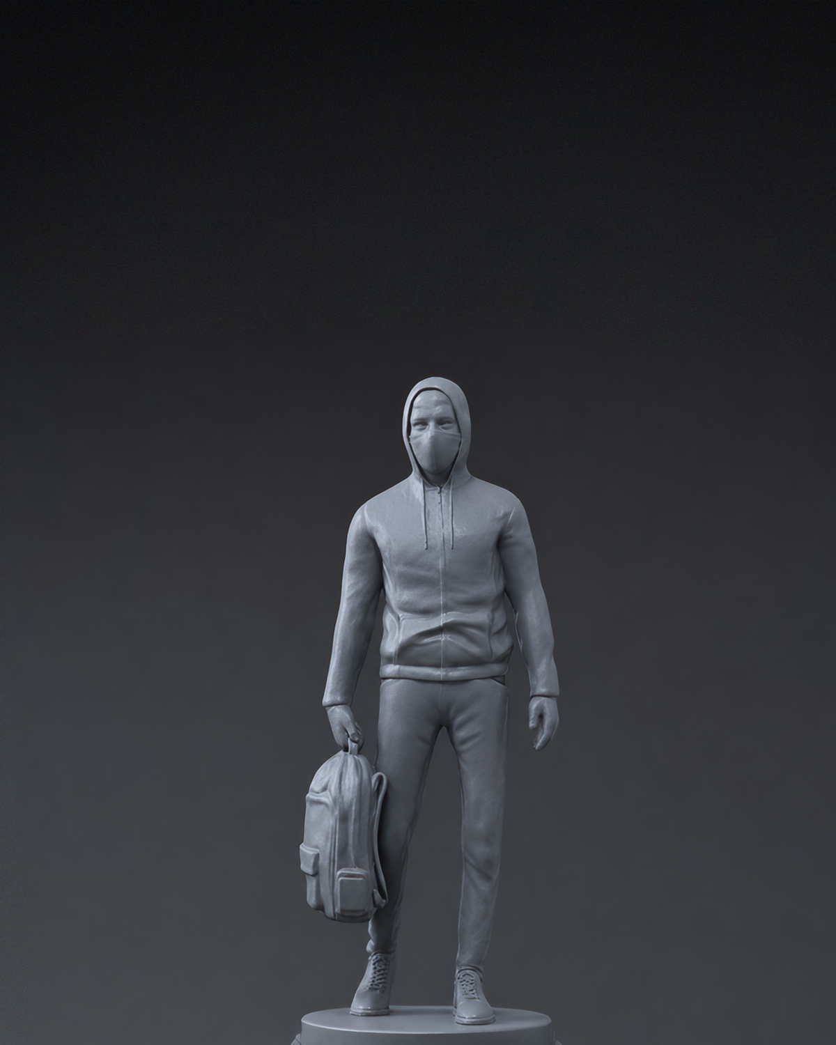 Alan Walker Faded Figurine unboxed, grey hooded Walker statue holding a backpack against a dark backdrop