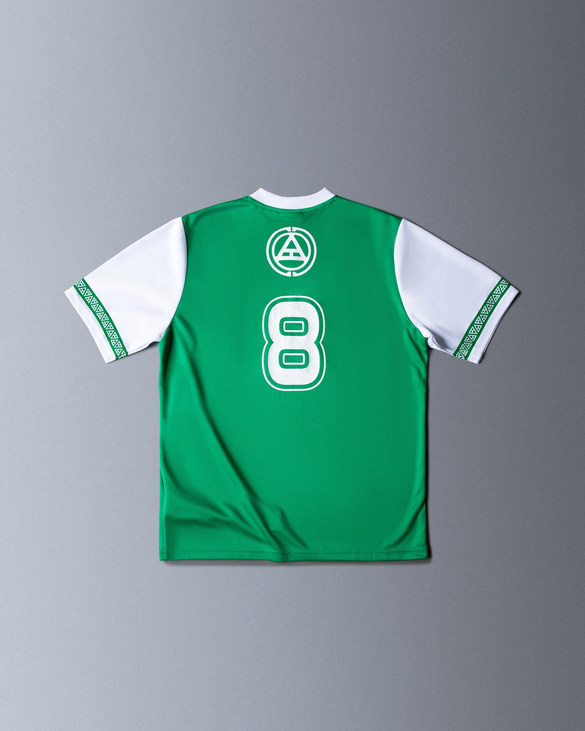Alan Walker Creator Circle Tribe Jersey back flat lay, green mesh with a white number 8 below the circular crest