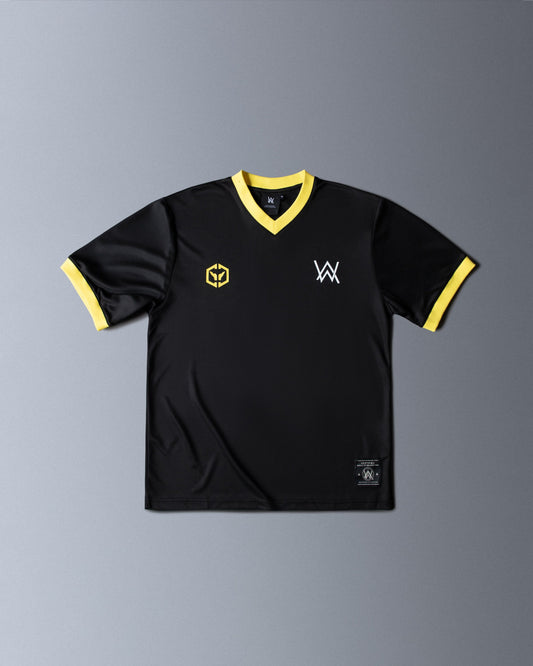 Alan Walker CheckPoint One Tribe Jersey front flat lay, black shirt with yellow V-neck trim and hex crest