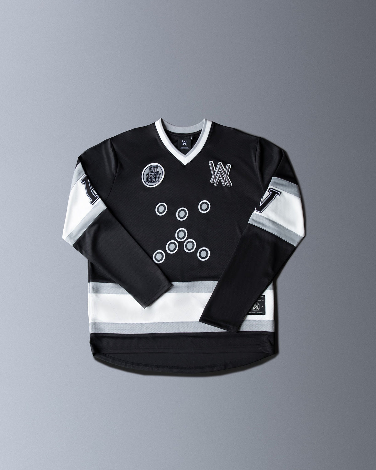 Alan Walker 8 Hockey Jersey front flat lay in black with striped sleeves, AW logo and Est 1997 patch