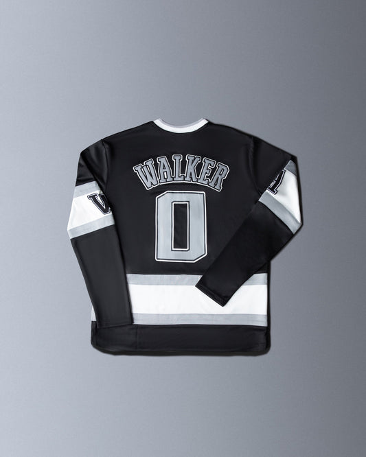 Alan Walker 0 Hockey Jersey back flat lay, black jersey with white Walker nameplate, number 0 and stripes