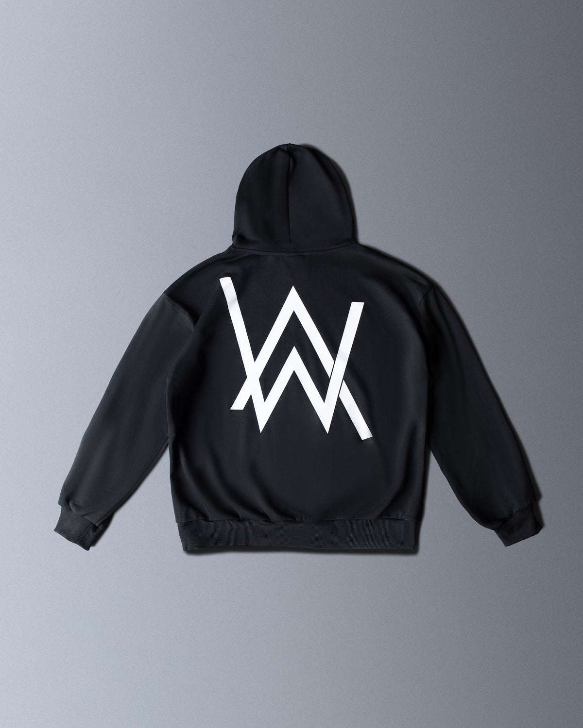 Alan Walker Core Logo Hoodie Vol 2 back flat lay, oversized black fleece with a large white AW logo