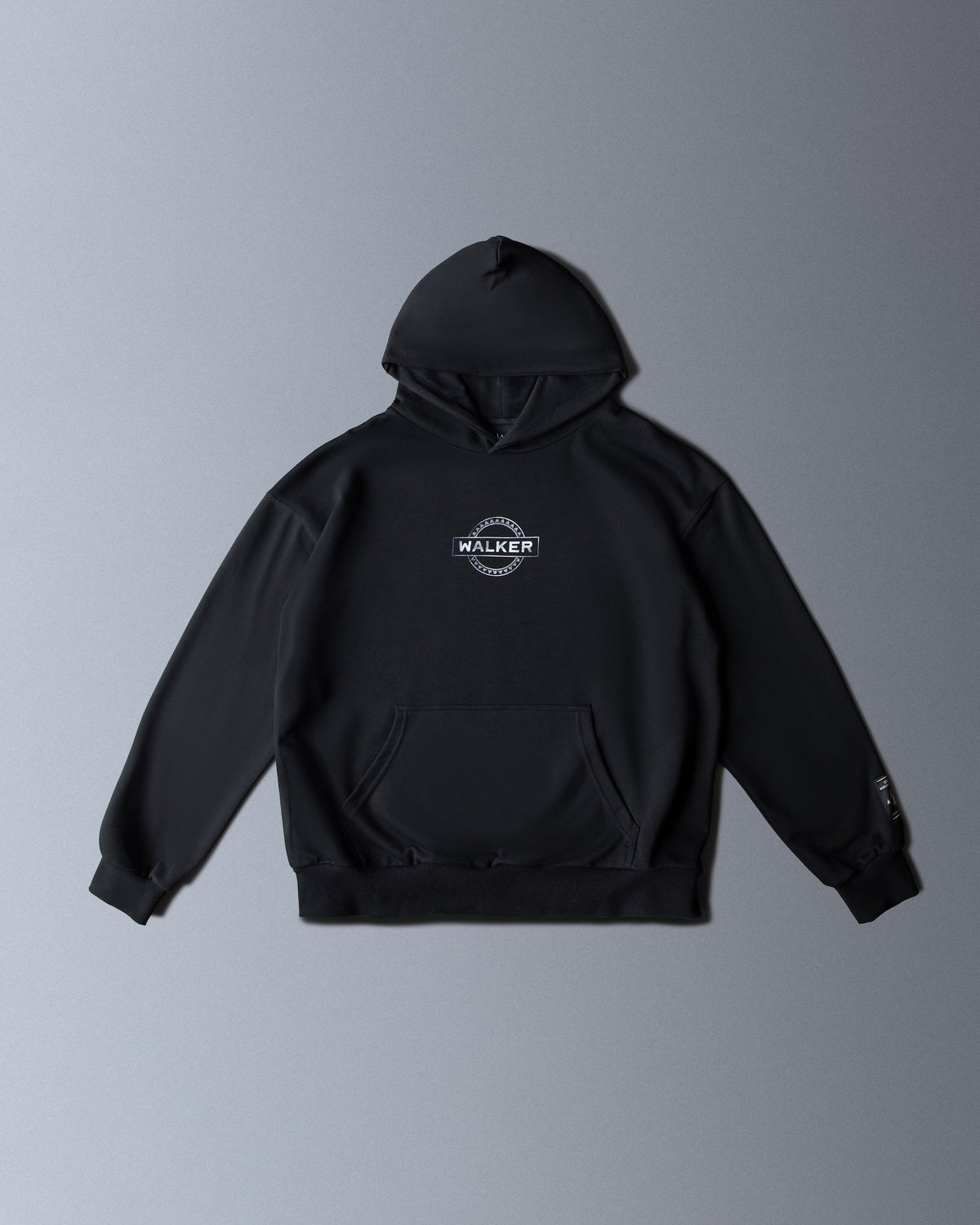 Alan Walker Monster Core Hoodie in black, front flat lay with circular Walker crest logo on the chest