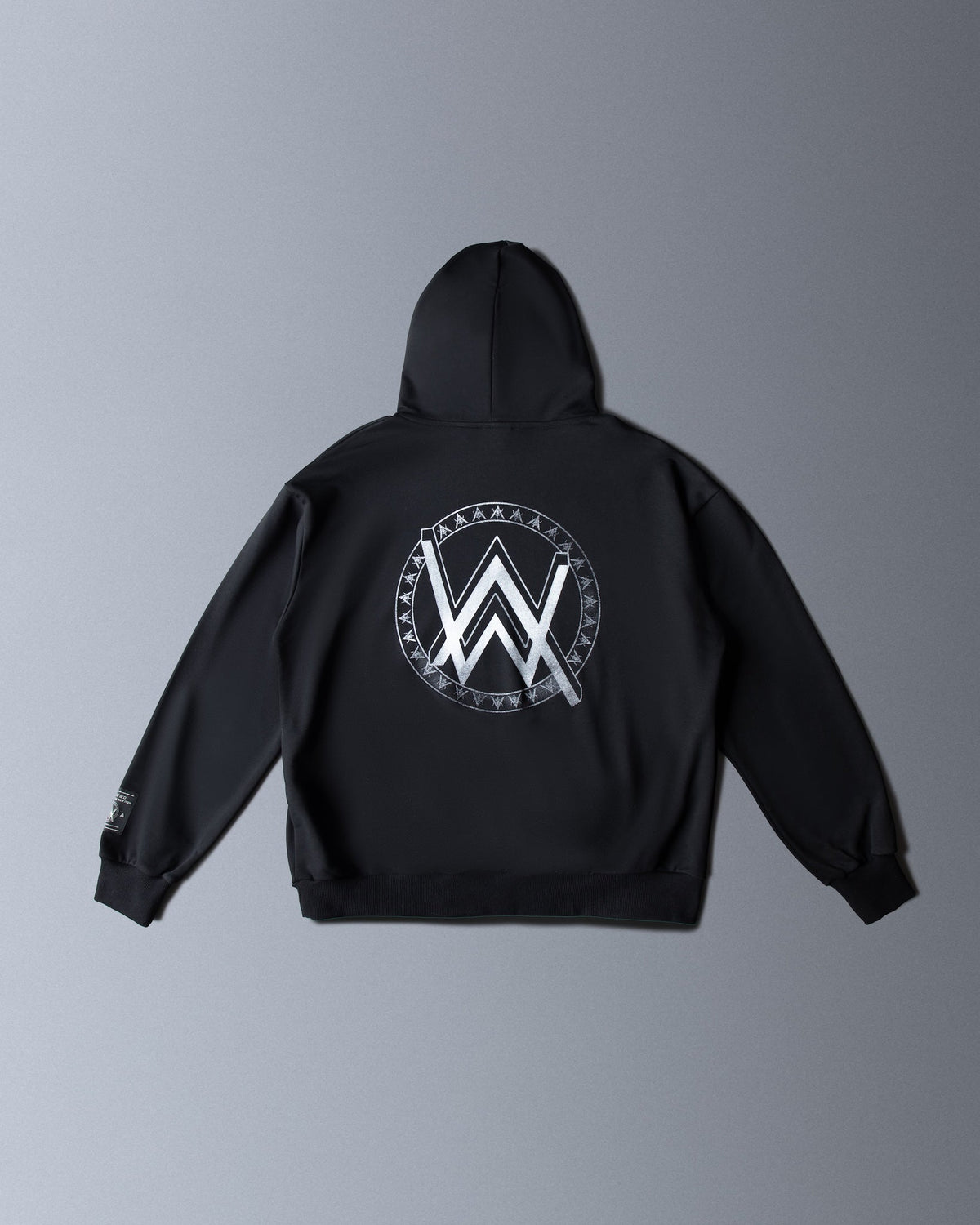 Alan Walker Monster Core Logo Hoodie Bundle adult hoodie back flat lay, oversized silver AW crest on black fleece