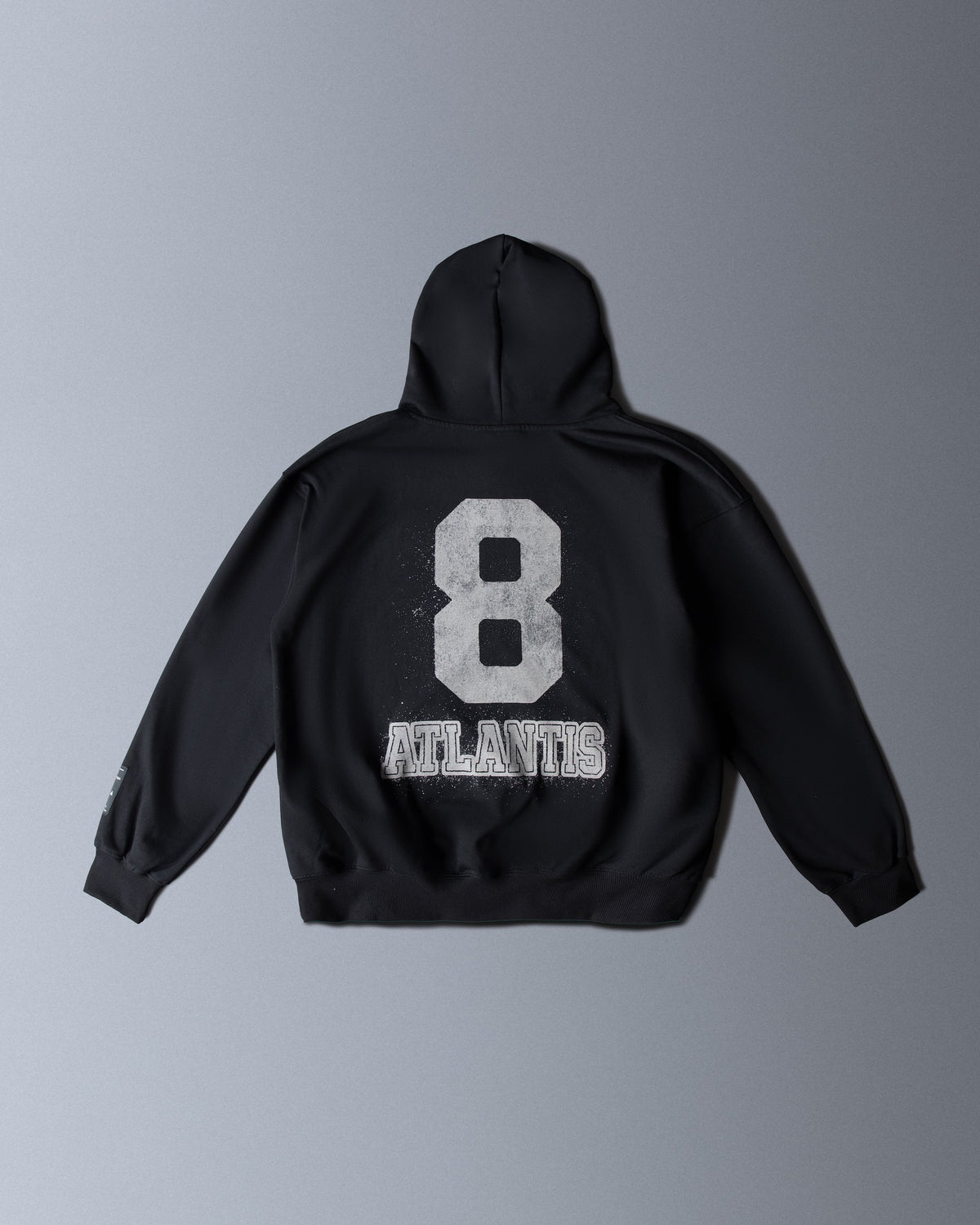 Alan Walker Atlantis 8 Hoodie back flat lay, black fleece with a white varsity 8 above Atlantis lettering