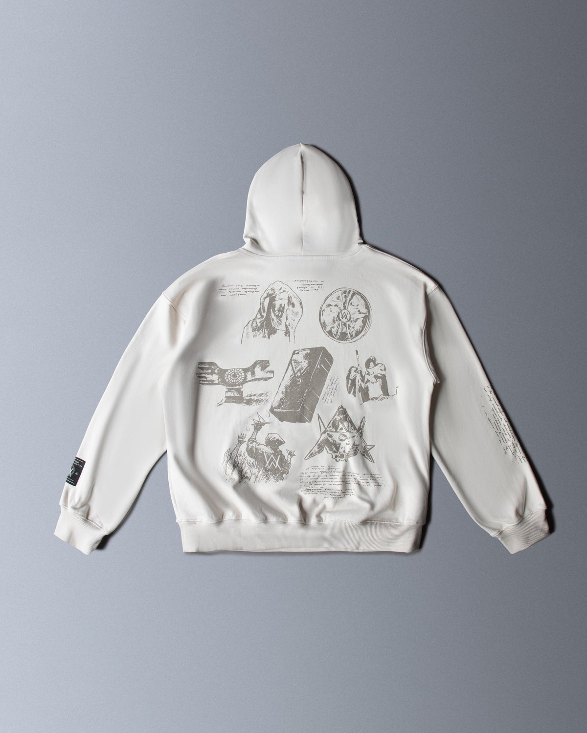 Alan Walker Encyclopedia Hoodie back flat lay, off white fleece covered in fine sketched lore illustrations