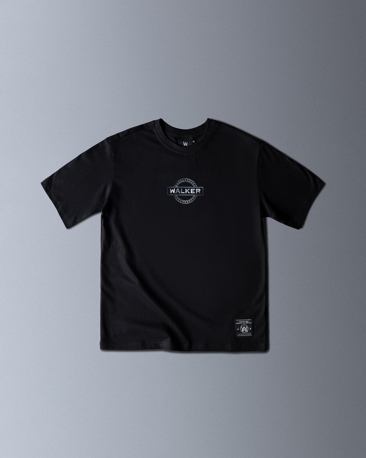 Alan Walker Monster Core T-Shirt front flat lay in black, small WALKER circle stamp on the chest and woven hem tag