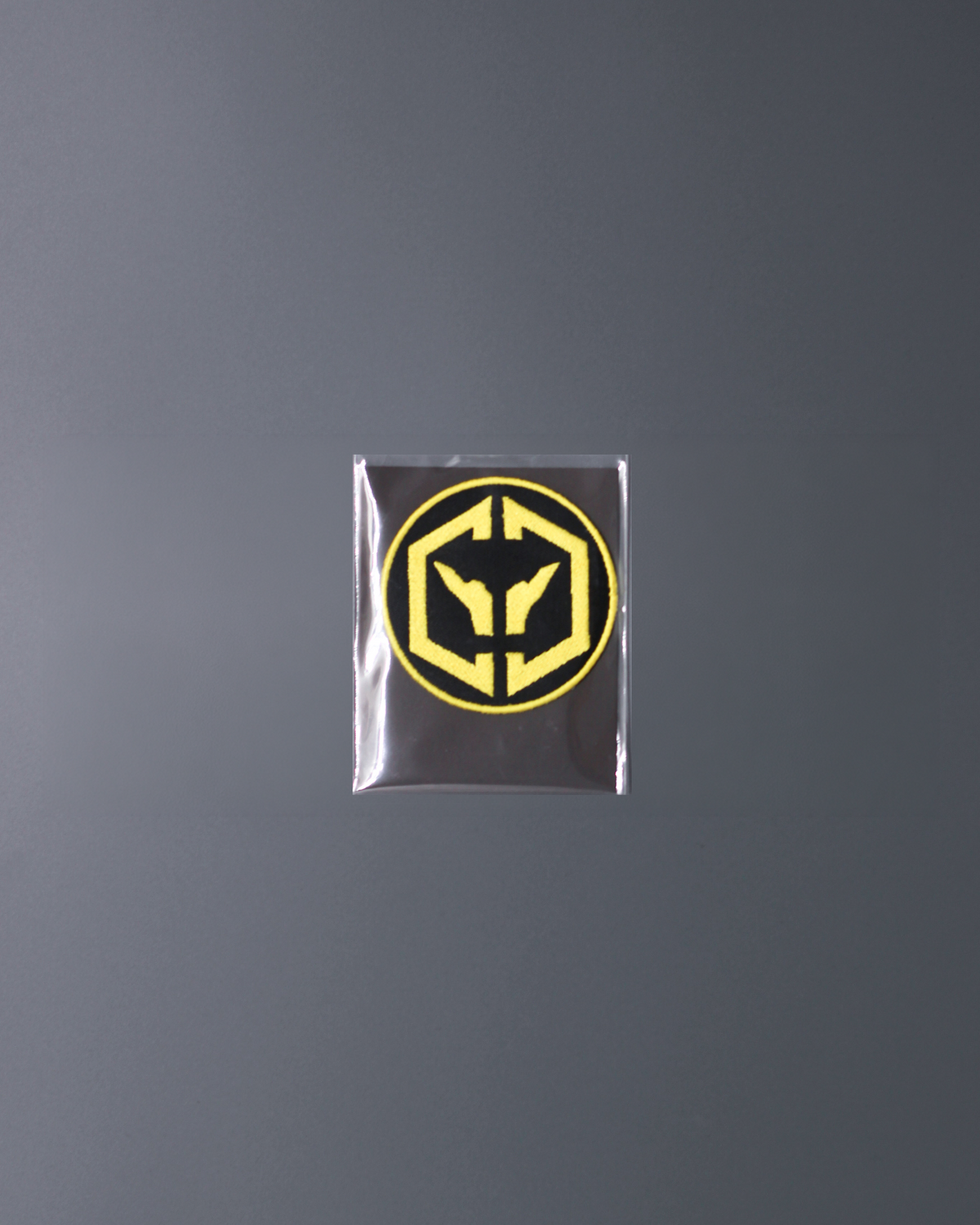 Alan Walker CheckPoint One Tribe Bundle patch packaged flat on grey, small round yellow tribe emblem