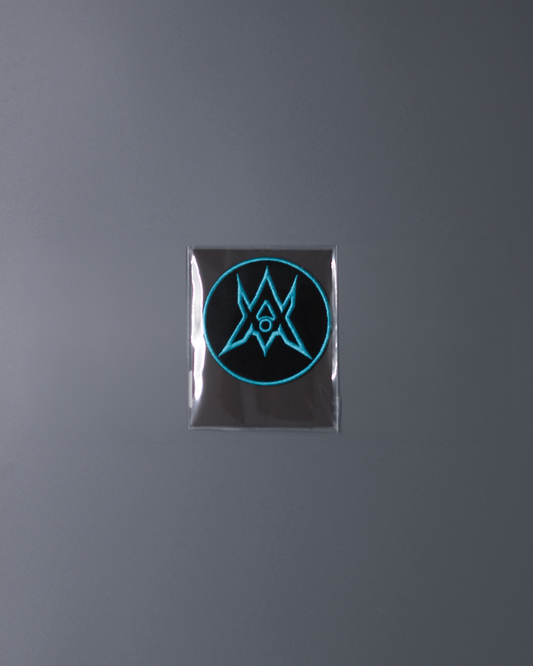 Alan Walker Unity Force Tribe Patch in cyan, circular embroidered crest sealed in a clear sleeve