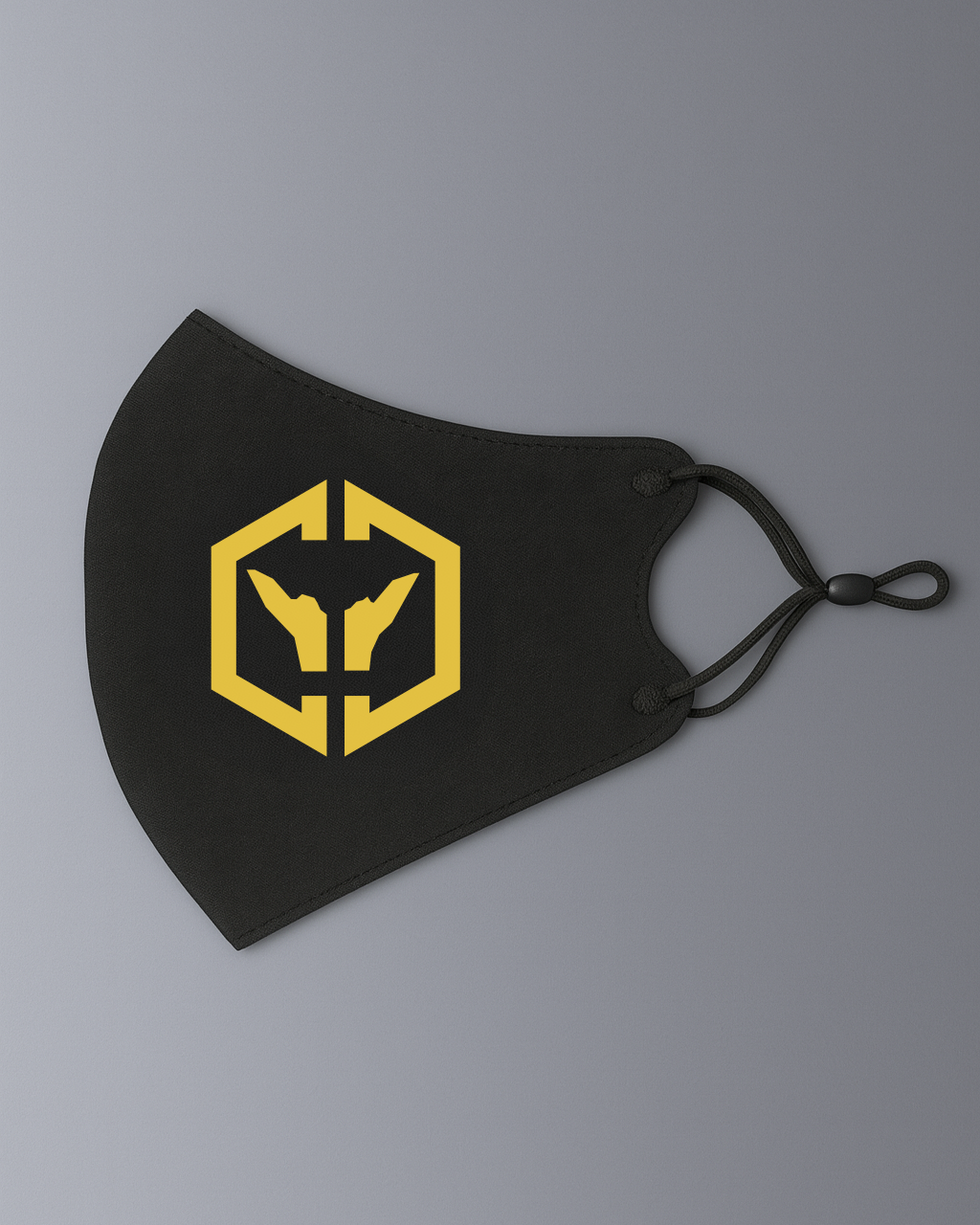 Alan Walker CheckPoint One Tribe Bundle face mask in black with a yellow hex crest and elastic ear loops