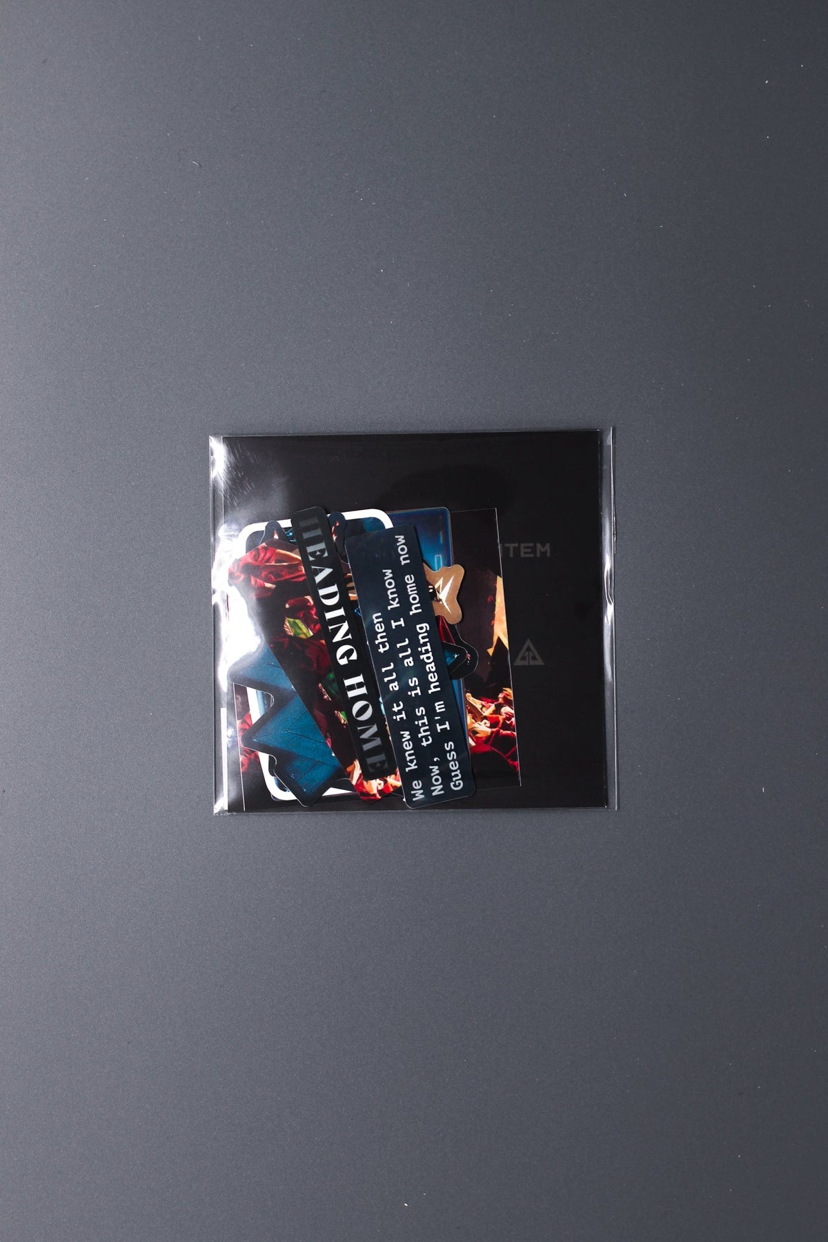 Alan Walker Heading Home Sticker Pack sealed in its clear packet on grey, Heading Home artwork visible inside