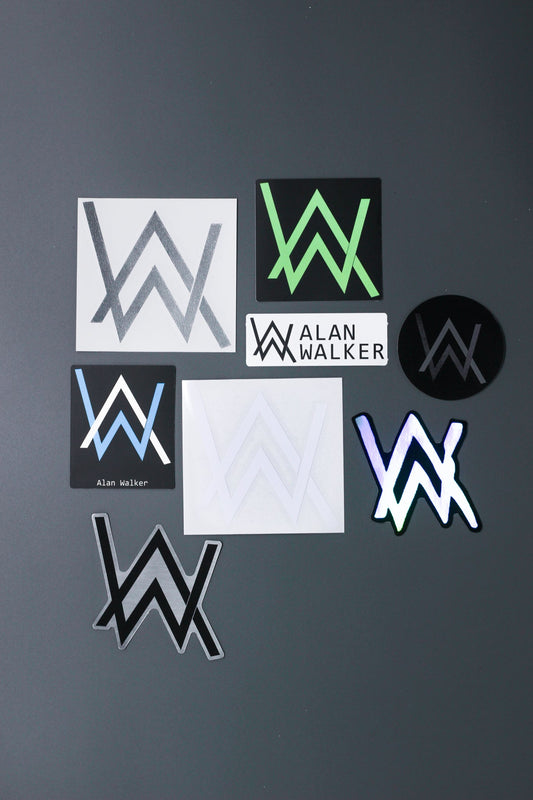 Alan Walker Logo Sticker Pack spread on grey, AW emblem decals in white, green, blue and holographic finishes