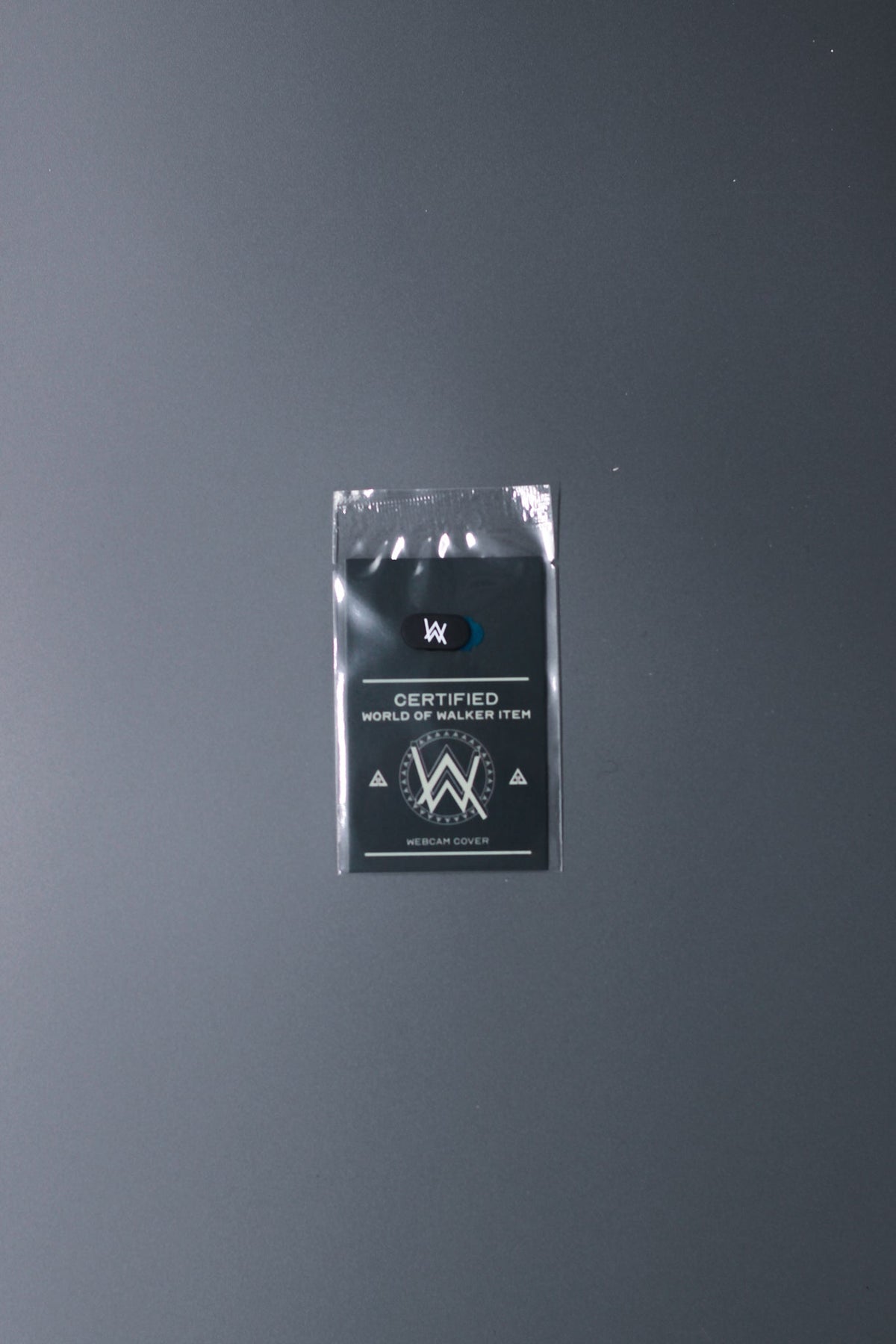 Alan Walker Webcam Cover sealed in its clear retail pouch with the World of Walker backing card