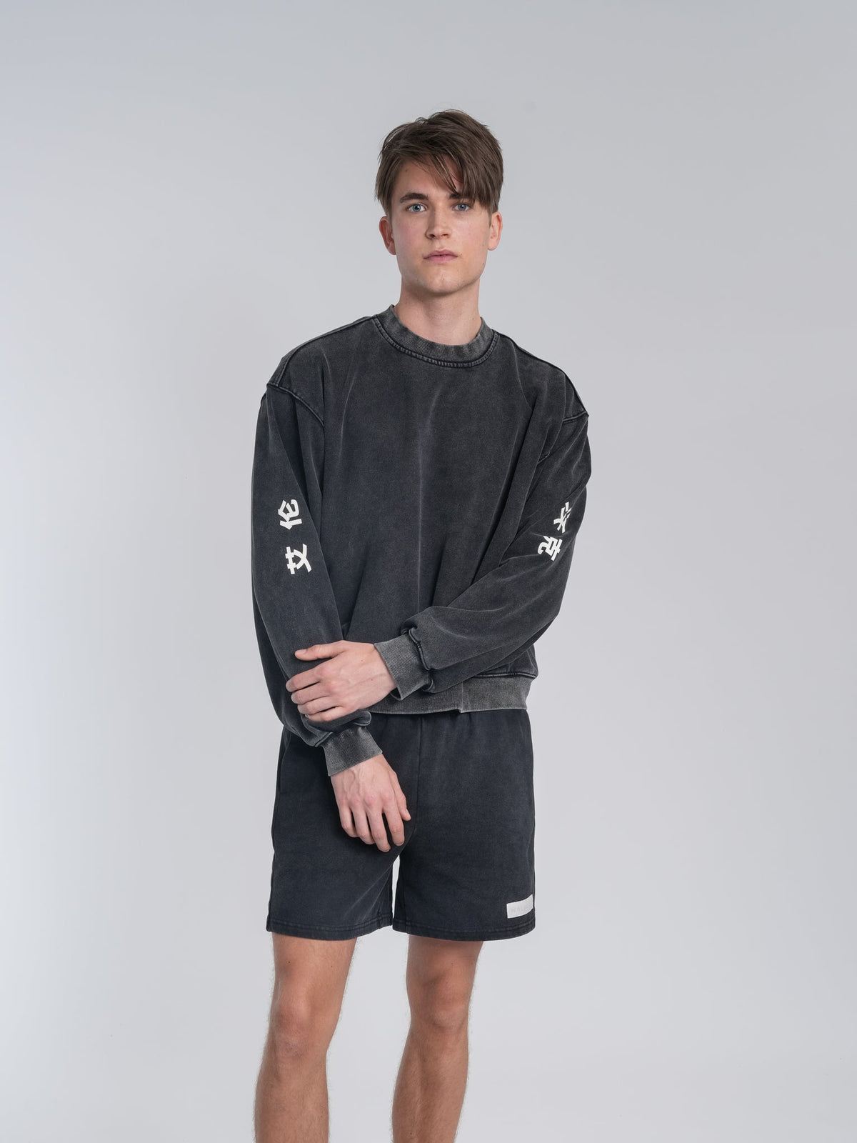Alan Walker Crew Washed Alan Shorts on a model, full front look styled with the matching washed crew sweatshirt