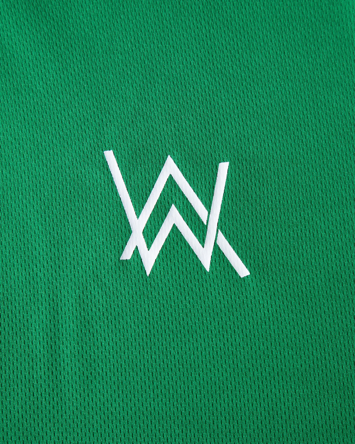 Alan Walker Creator Circle Tribe Jersey chest print close-up, white AW monogram on green breathable mesh