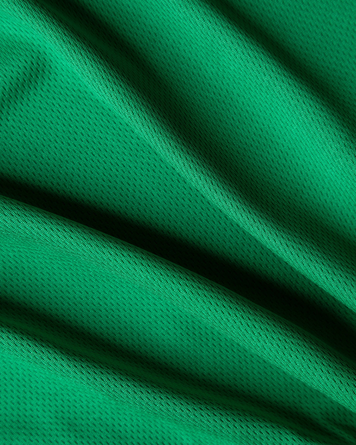 Alan Walker Creator Circle Tribe Jersey fabric close-up, soft folds of green breathable sports jersey mesh