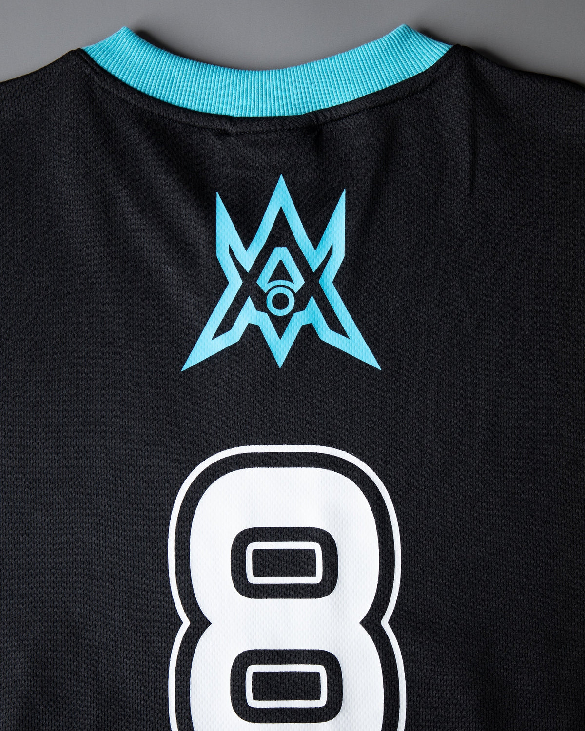 Alan Walker Unity Force Tribe Jersey back detail, cyan tribe crest sitting above the white number 8