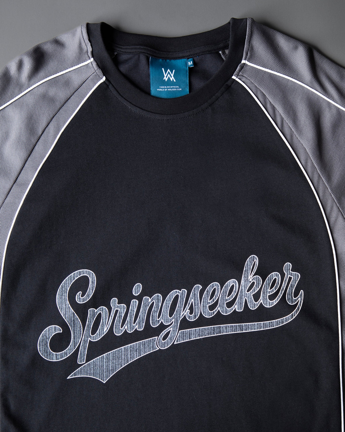 Alan Walker Springseeker Sports T-Shirt front detail, contrast grey raglan sleeves with white piping and AW tag