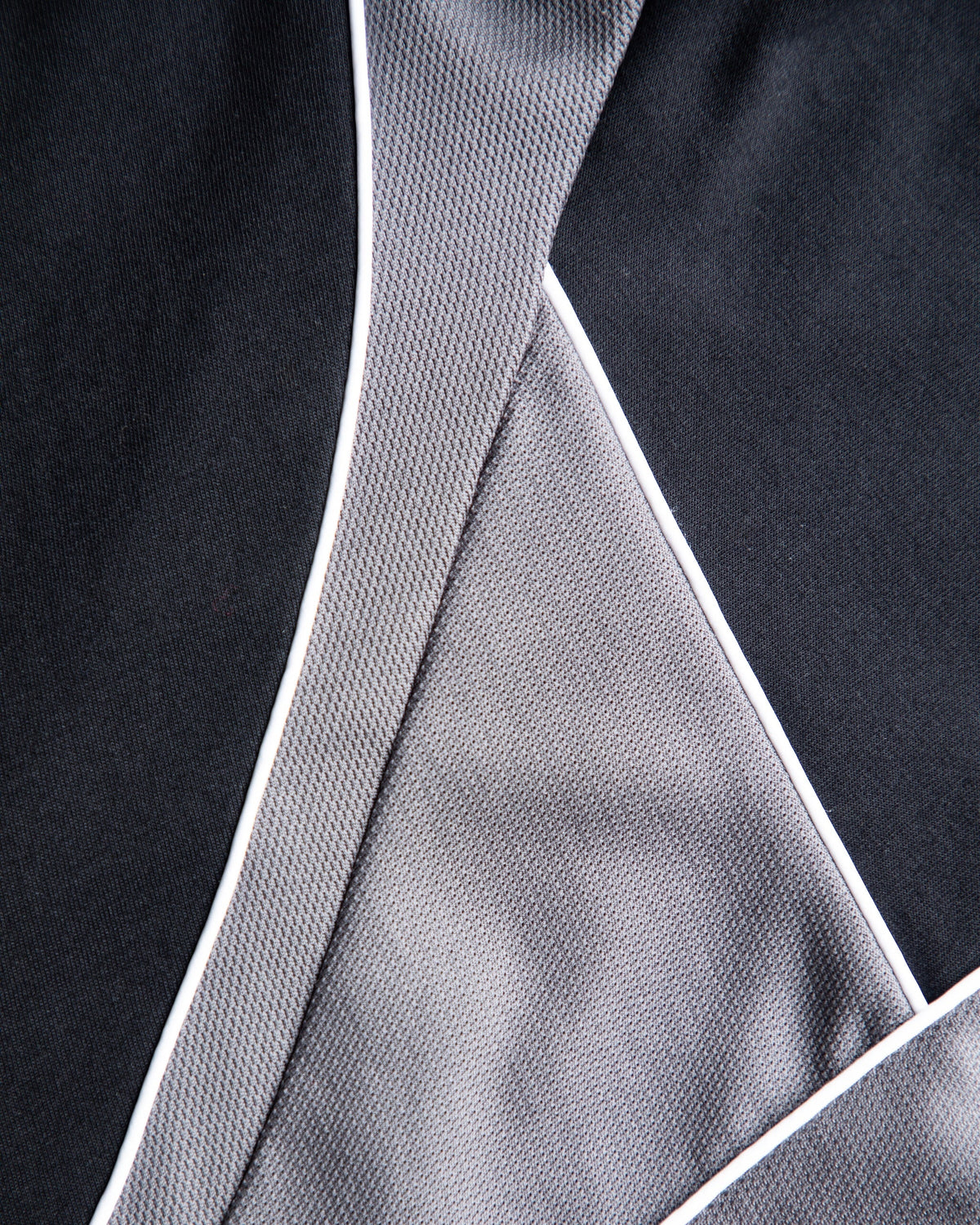Alan Walker Springseeker Sports T-Shirt panel close-up, grey mesh shoulder inset with white piped seams