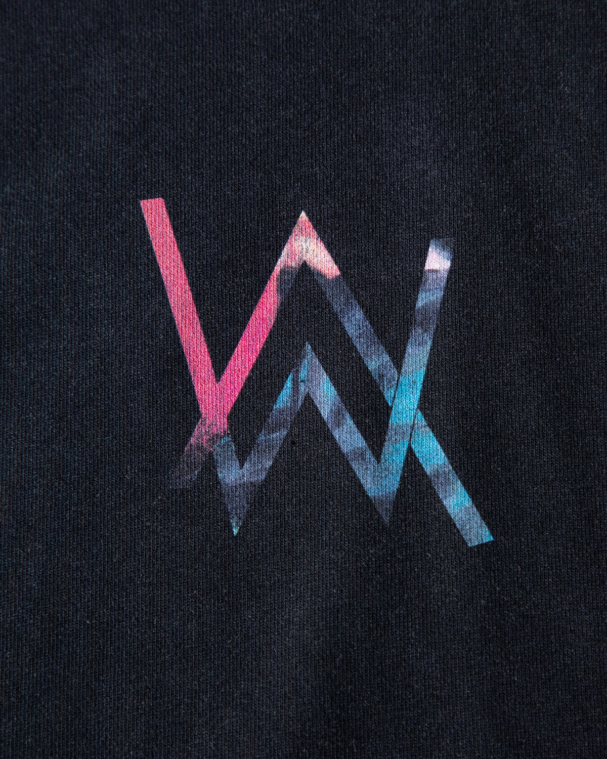Alan Walker Heading Home Hoodie chest print close-up, AW monogram filled with pink and blue nebula colour