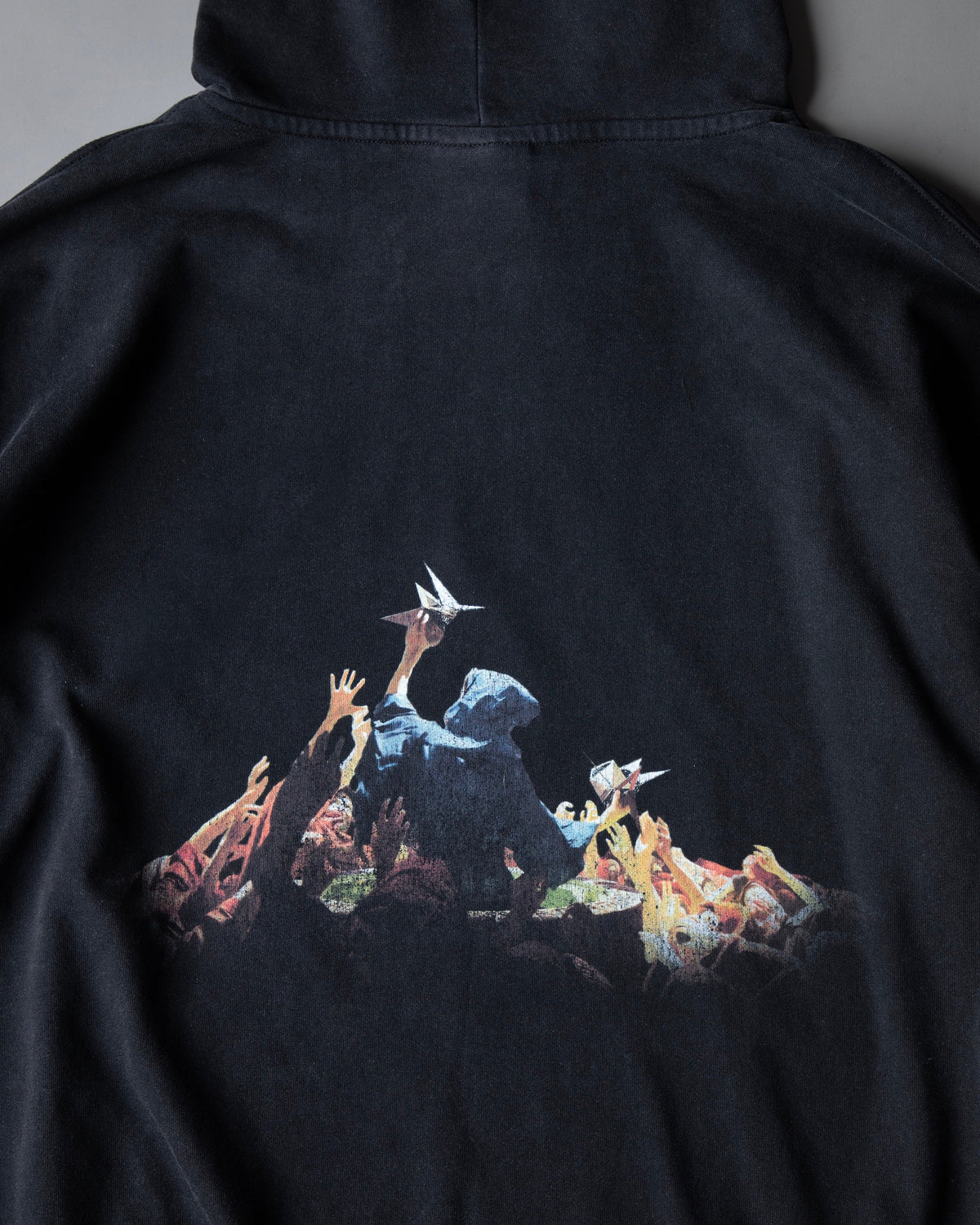 Alan Walker Heading Home Hoodie back artwork detail, hooded figure raised by outstretched hands in colour
