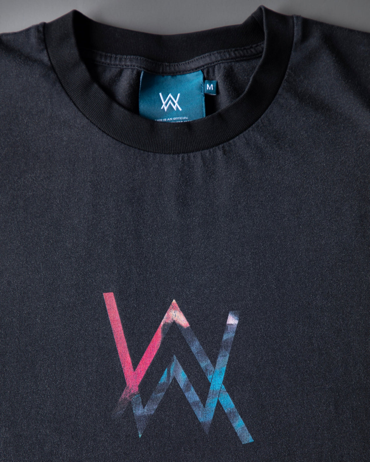 Alan Walker Heading Home Longsleeve collar close-up, teal AW neck label above the nebula chest print