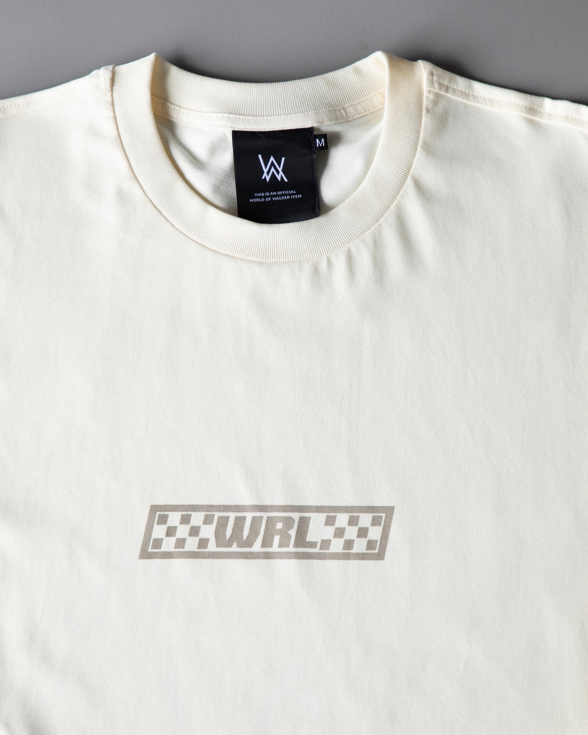 Alan Walker WRL Logo Longsleeve in off white, collar and chest detail with black AW neck label above grey WRL logo