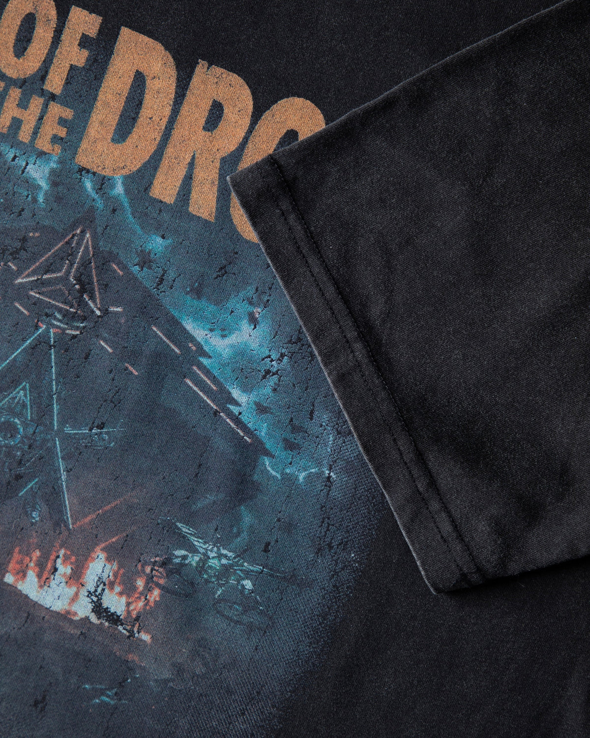 Alan Walker Rise Of The Drone Vintage T-Shirt print close-up, orange drone lettering over the burning scene