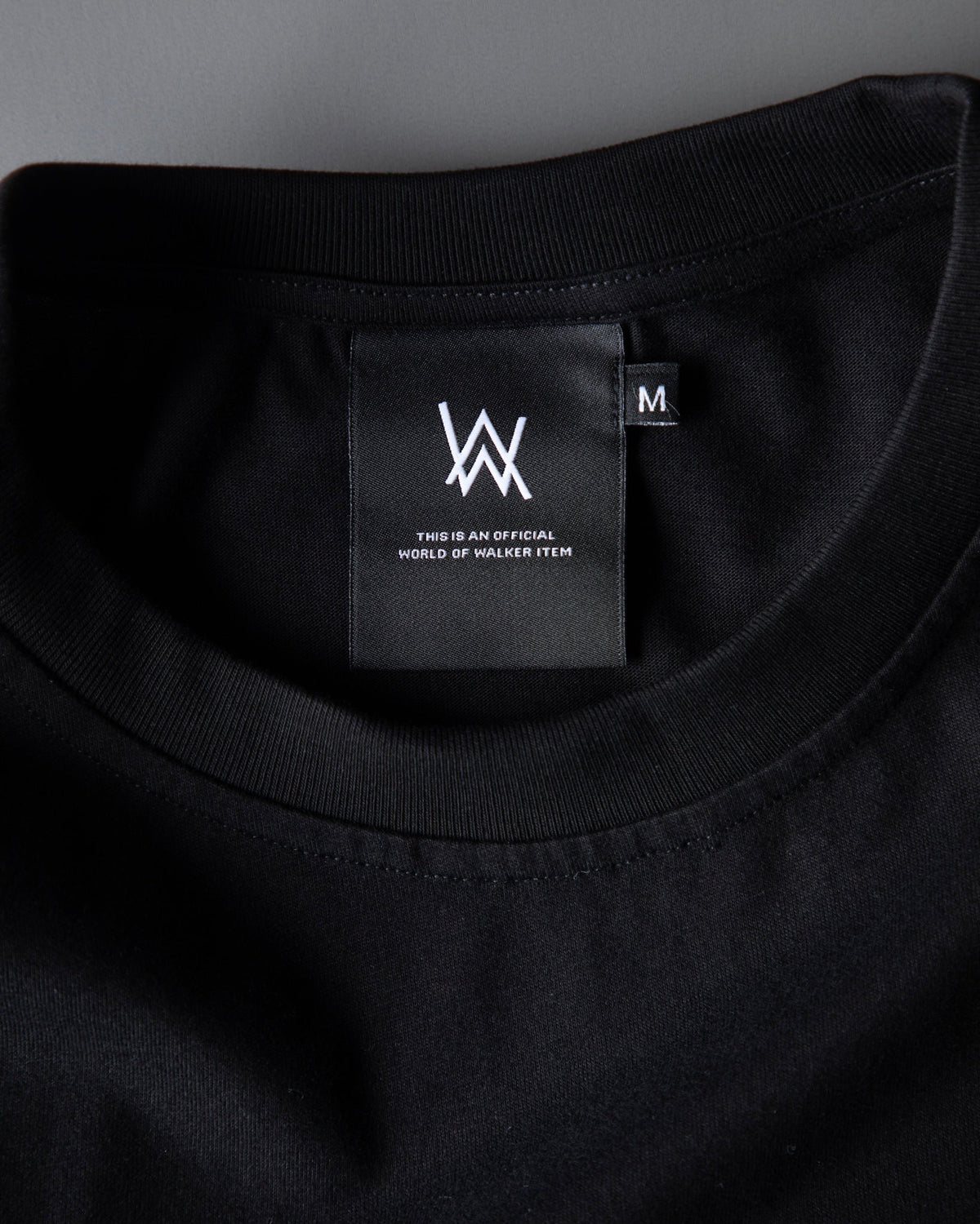 Alan Walker Monster Core T-Shirt inner collar detail, black tee with woven AW neck label marked size M
