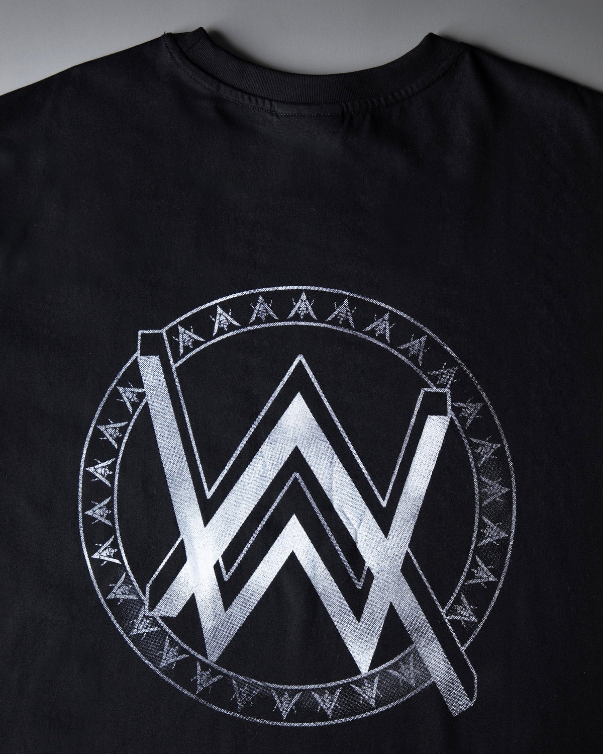 Alan Walker Monster Core T-Shirt back view, large silver AW logo in a runic circle across black fabric