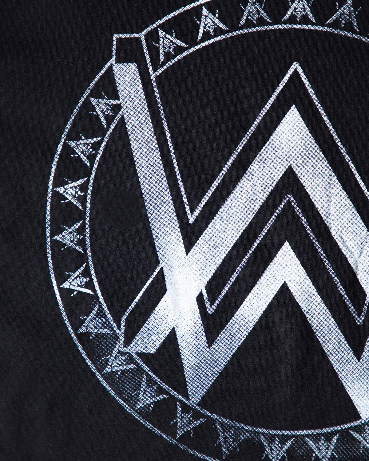 Alan Walker Monster Core T-Shirt print close-up, metallic silver AW mountain logo edged by a runic ring