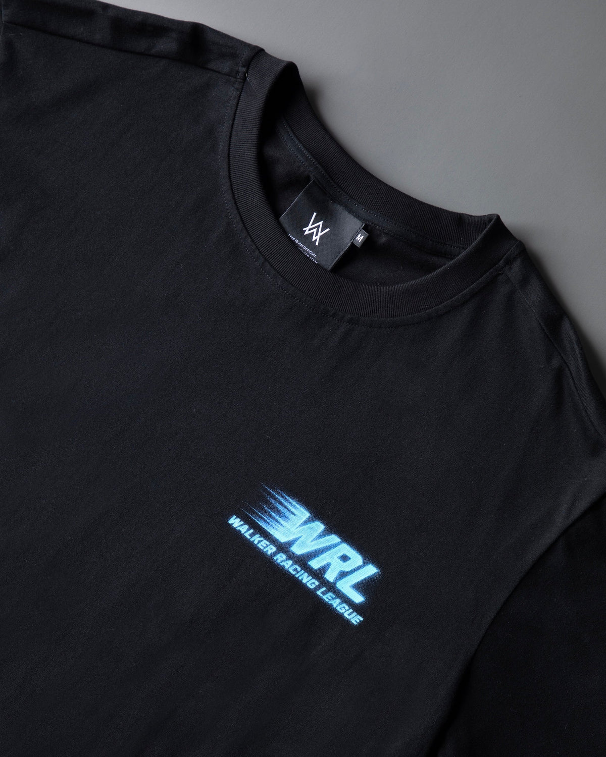 Alan Walker WRL Speed Logo T-shirt chest detail, blue Walker Racing League logo beside the AW neck label