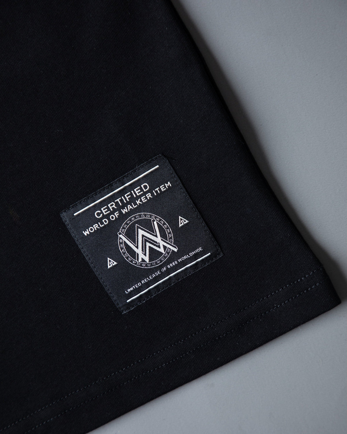 Alan Walker World of Walker Skyline T-shirt hem detail with the World of Walker woven black label