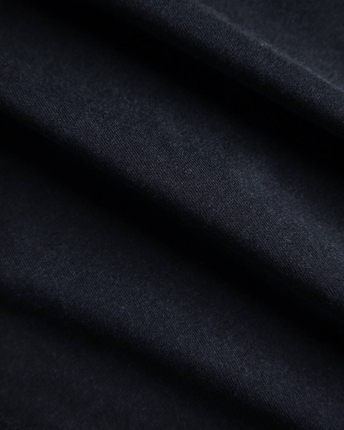 Alan Walker Faded Graffiti T-Shirt fabric close-up, lightweight black cotton jersey in soft folds