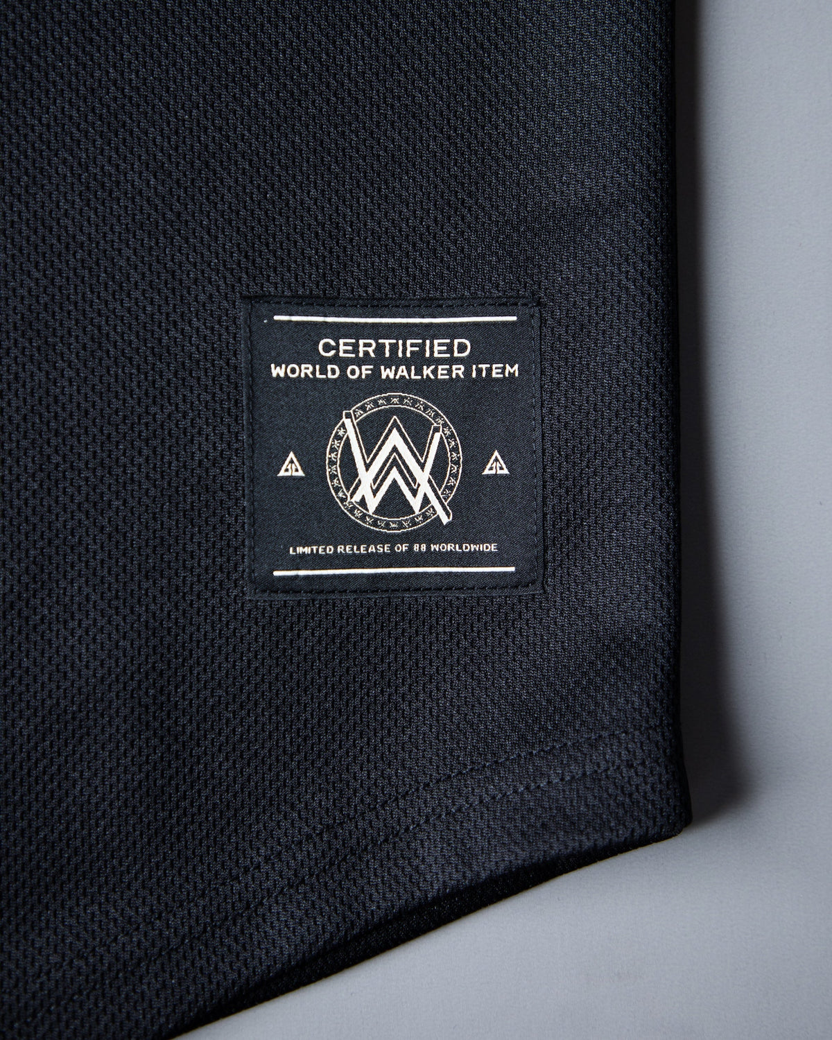 Alan Walker 0 Baseball Jersey hem detail, World of Walker Item woven label on black mesh