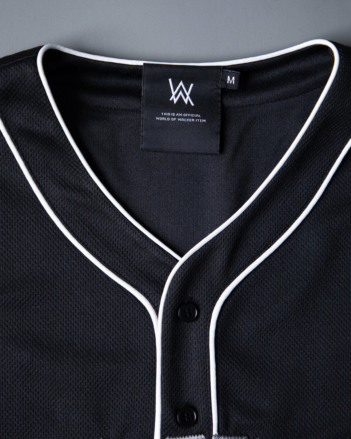 Alan Walker 0 Baseball Jersey collar close-up with inner AW neck label and white piped button placket