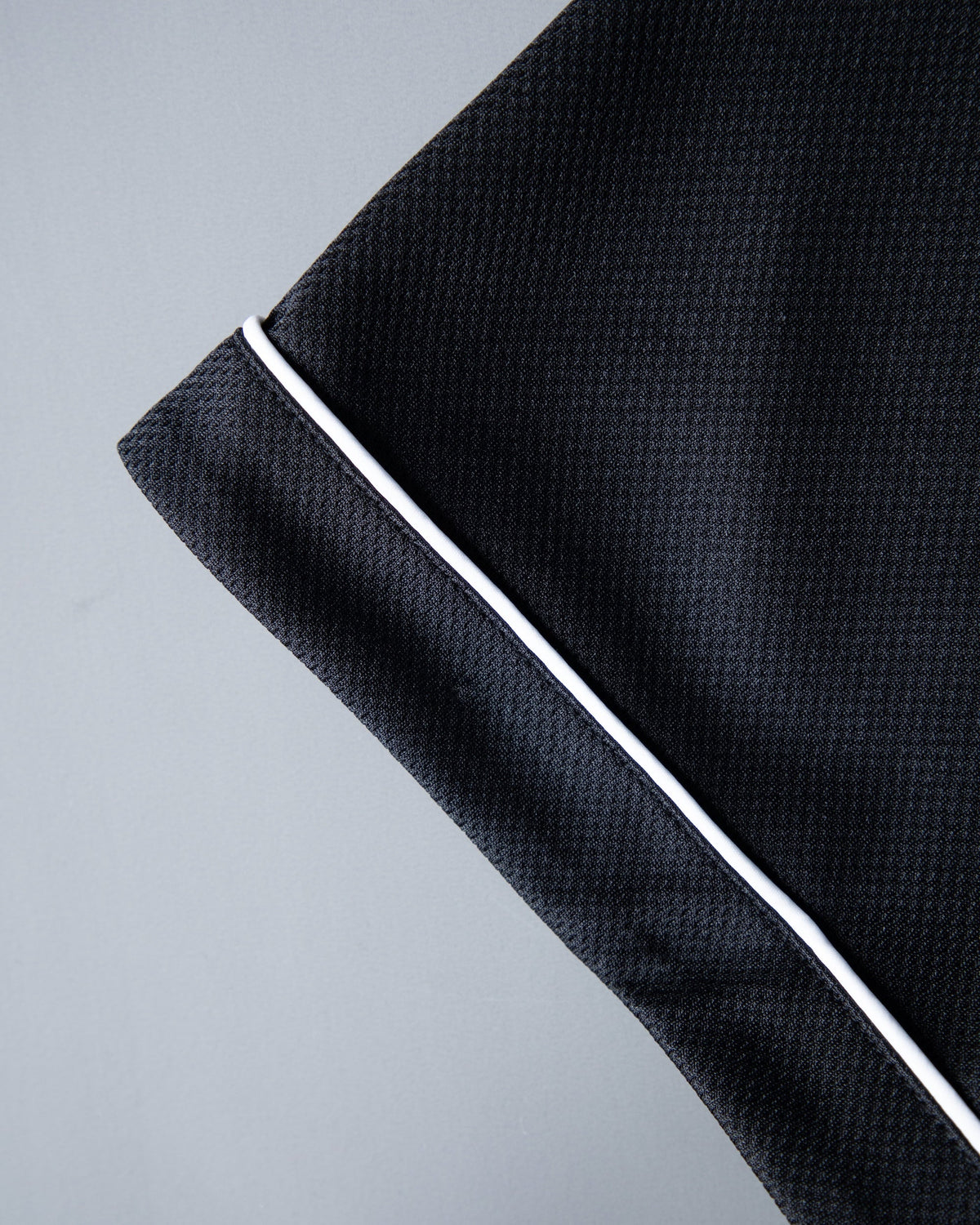 Alan Walker 8 Baseball Jersey sleeve cuff detail with white contrast piping on breathable black mesh