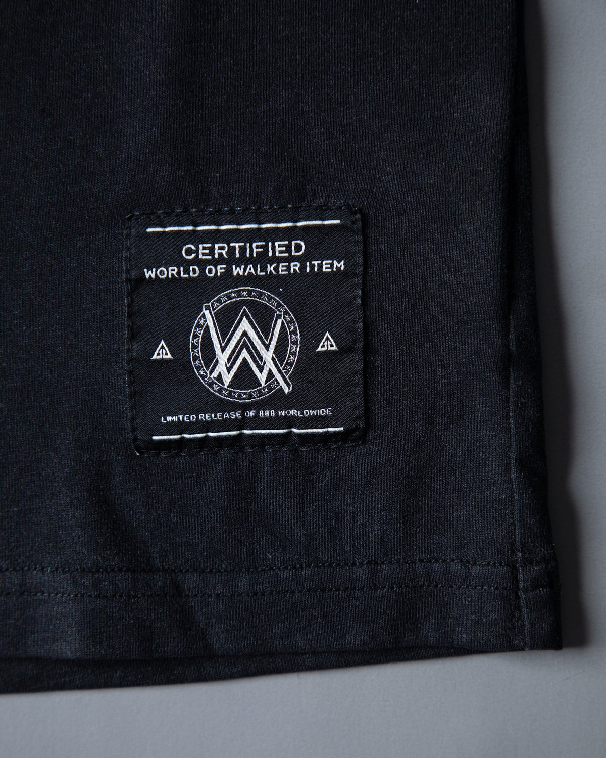 Alan Walker Faded Graffiti Longsleeve hem detail with the black woven World of Walker label