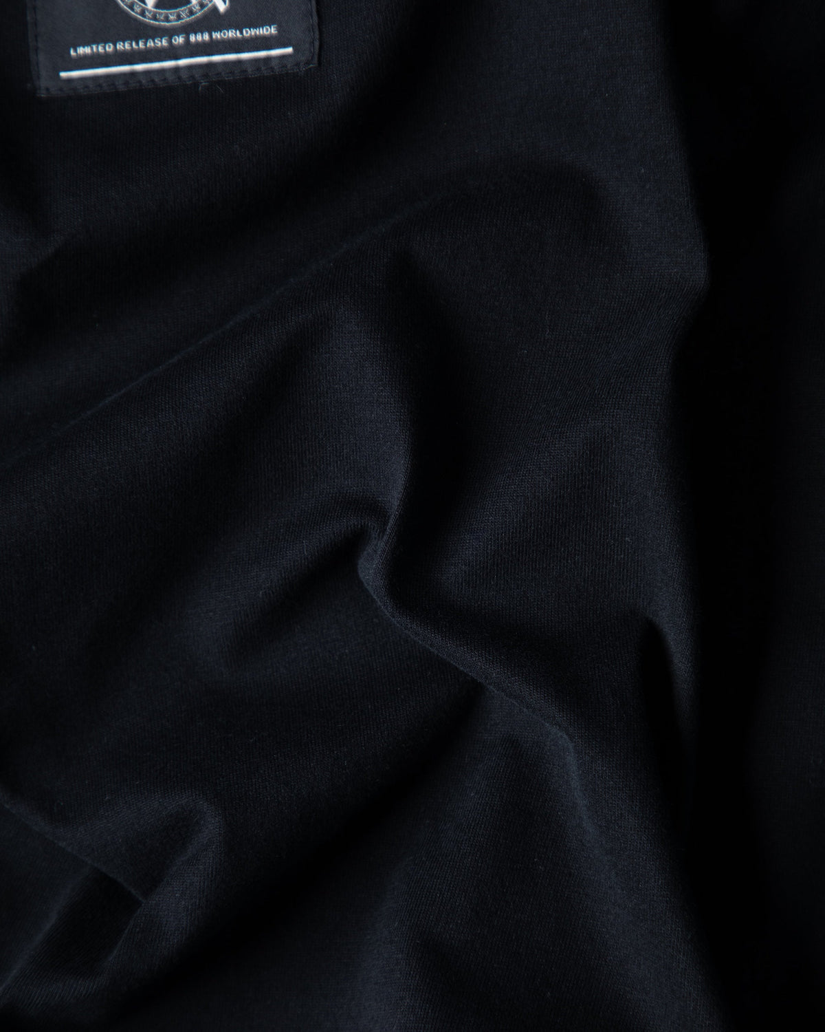Alan Walker Prophecy Disc VIII Longsleeve fabric close-up, draped black cotton under the limited release tag