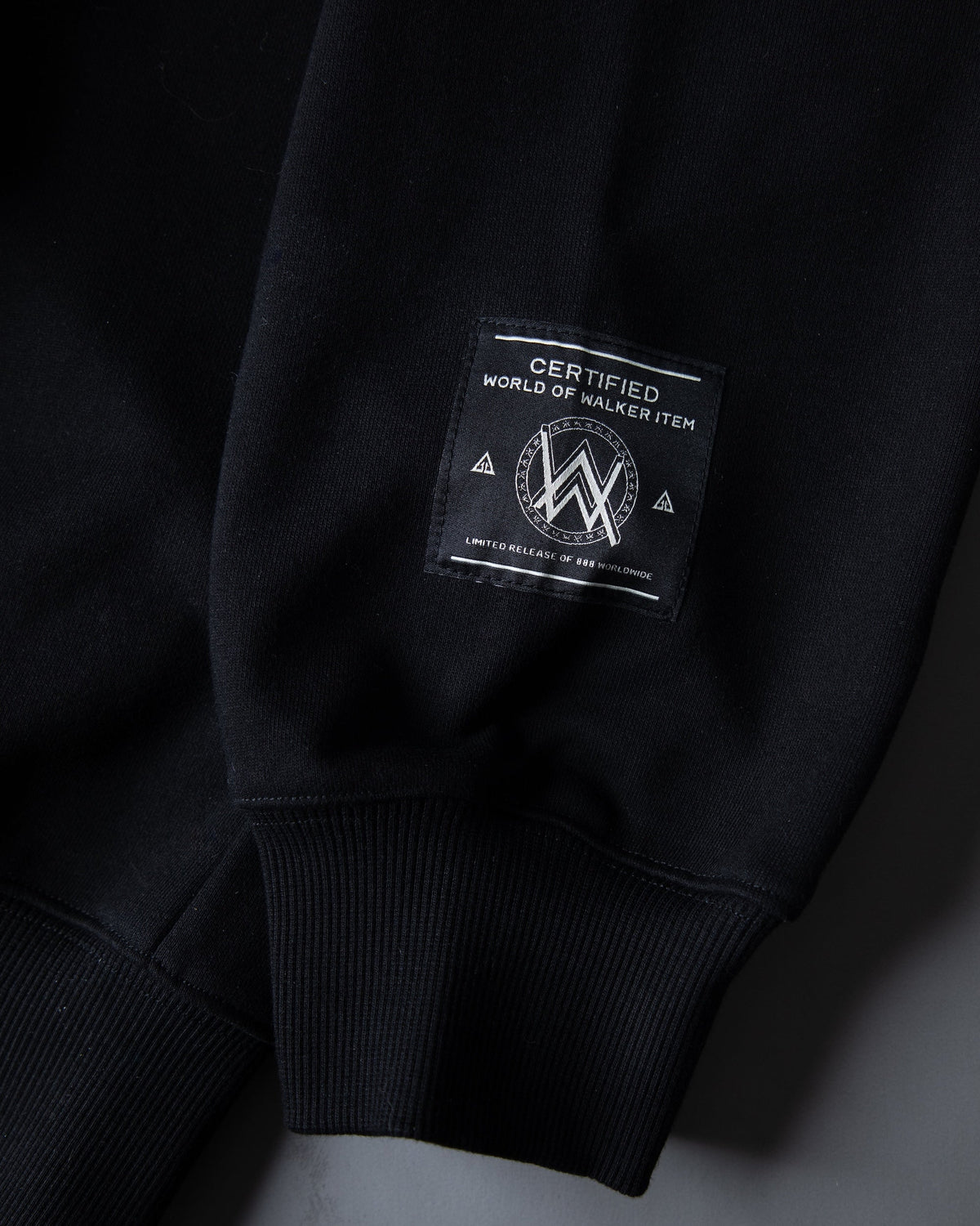 Alan Walker Watch The Drone Hoodie sleeve detail with woven World of Walker label on black cuff
