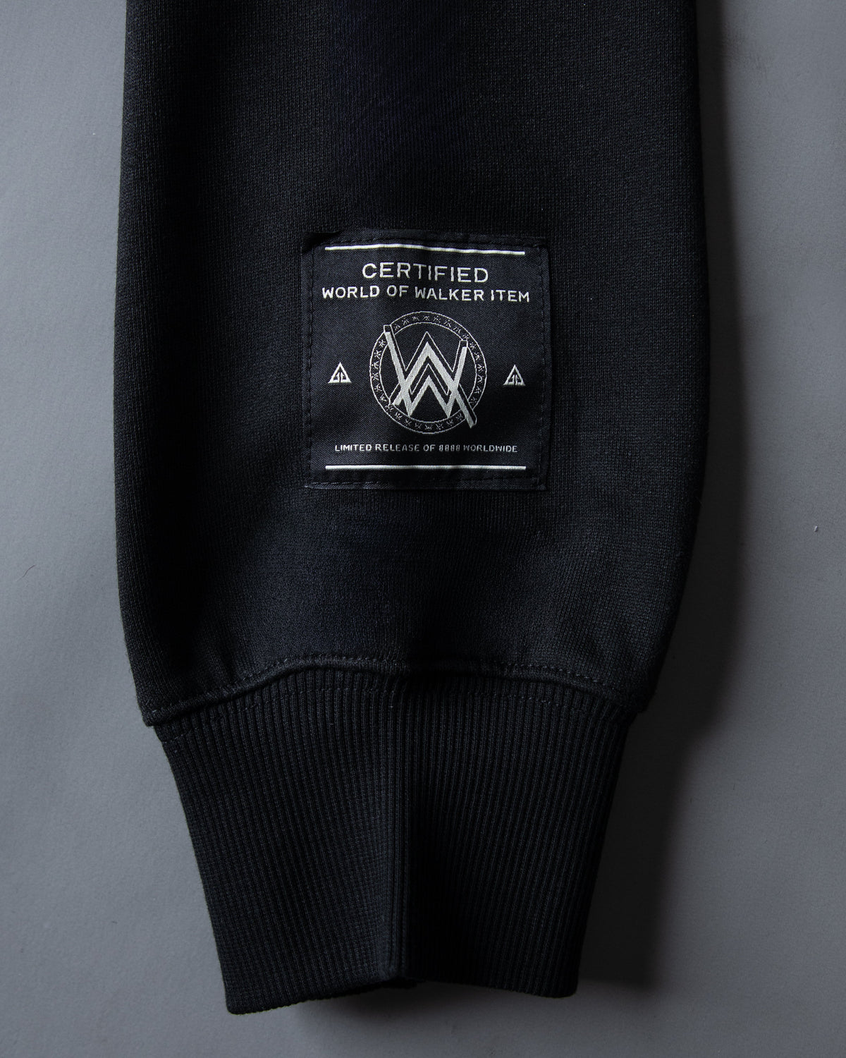Alan Walker World of Walker Skyline Hoodie cuff detail with the woven World of Walker label in black