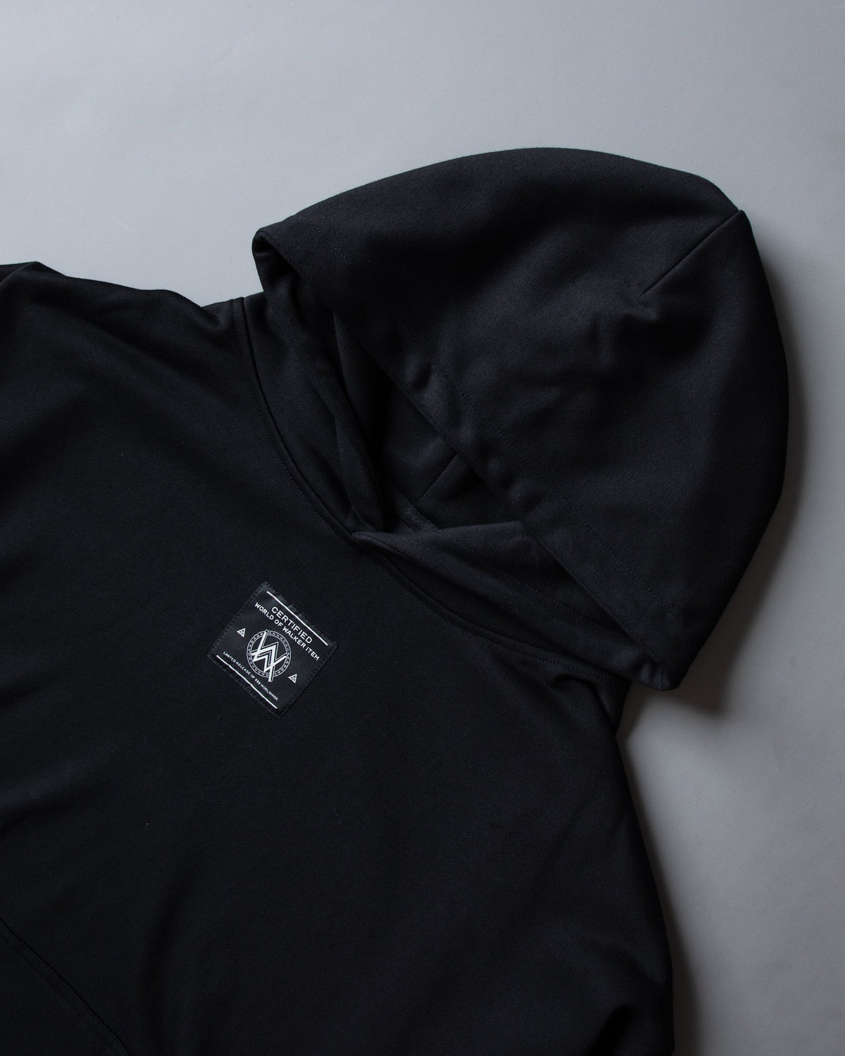Alan Walker Prophecy Disc VIII Hoodie hood detail, folded black fleece with woven AW label patch