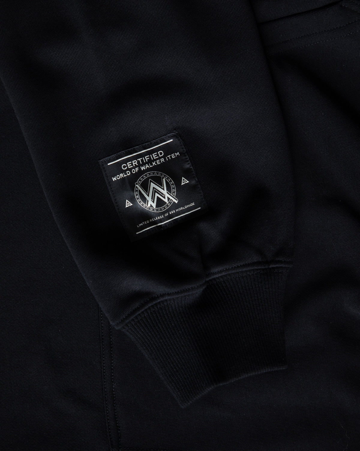Alan Walker Gaming Hoodie cuff detail with the World of Walker Item tag on black fleece
