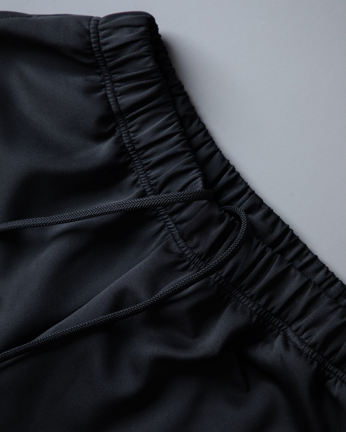 Alan Walker World of Walker Skyline Sweatpants elastic waistband and drawcord detail on black fabric