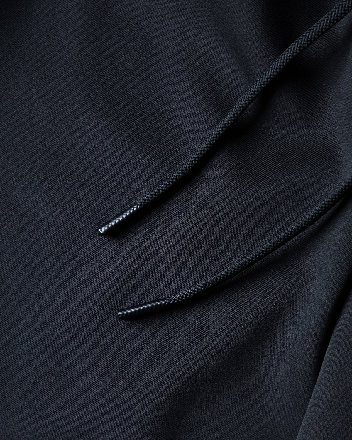 Alan Walker World of Walker Skyline Sweatpants drawstring cord close-up with silver tipped ends on black