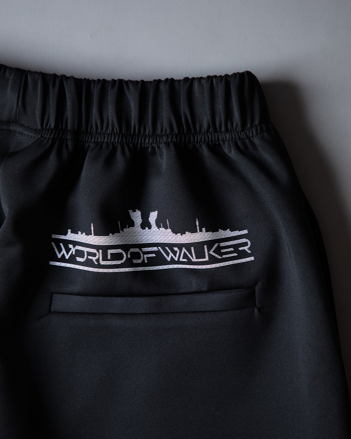 Alan Walker World of Walker Skyline Sweatpants back pocket detail with the white World of Walker skyline print