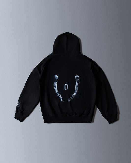 Alan Walker Tired 0 Hoodie in black, back flat lay with the two hooded figures and glowing zero graphic