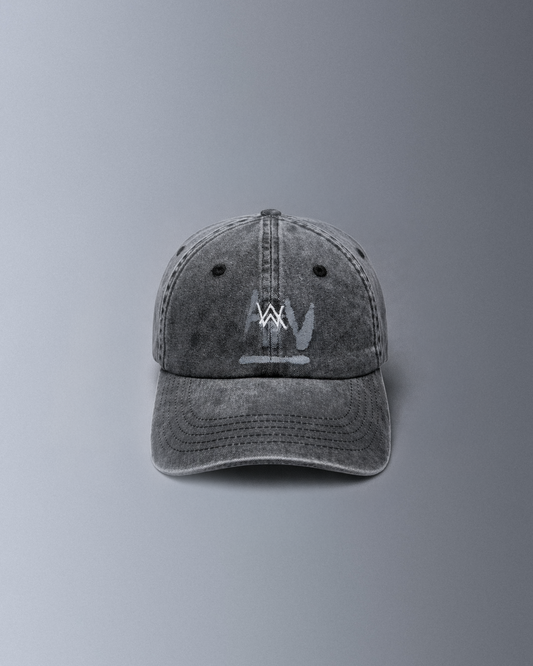 Alan Walker Faded Logo Cap front view, washed grey dad cap with the embroidered white AW logo on the crown