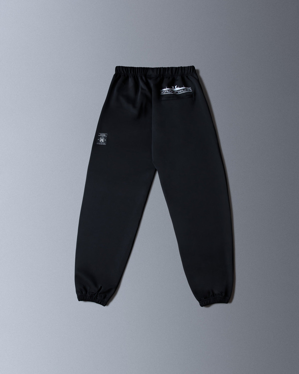 Alan Walker World of Walker Skyline Sweatpants back flat lay in black with the white skyline logo at the waist